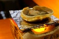 Japanese cuisine, raw crabÃÂ roe, served on charcoal stove